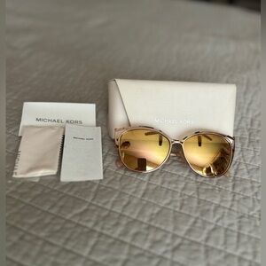 Michael Kors Ina Cat Eye Sunglasses in rose-gold with tortise frames.